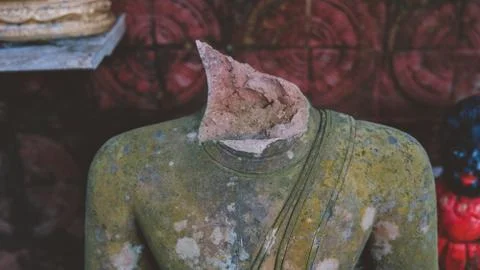 Broken statue of Buddha close-up Stock Photos