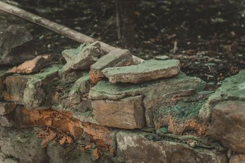 Broken stone brick steps partially overgrown with grass Stock Photos