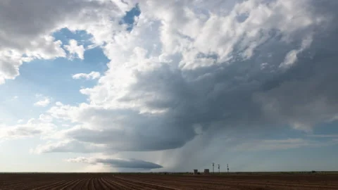 Broken storm moves over farm fields Stock Footage 272697201