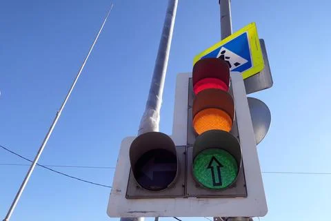 Broken street semaphore under blue sky Stock Photos