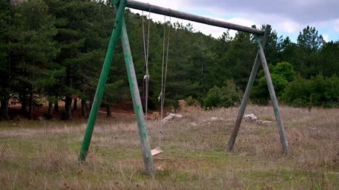 A broken swing at a public parkland. Stock Footage 293209840