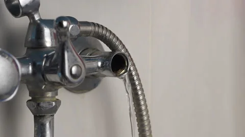 A broken tap is leaking water, a water leak, a broken tap, a close-up Stock Footage 88627088