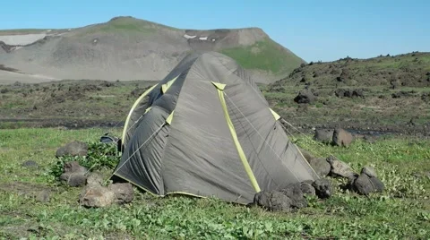 Broken tent on the green grass Stock Footage 67120233