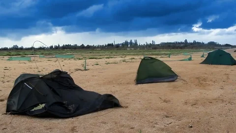 Broken tents at the beach Stock Footage 80799848