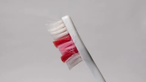 Broken toothbrush isolated on a white background. Stock Footage 313988365