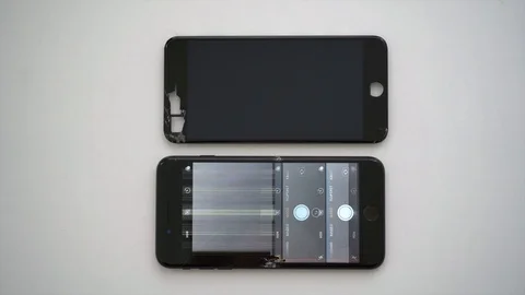 Broken touch screen display with camera turned on and broken display next. Stock Footage 119382472