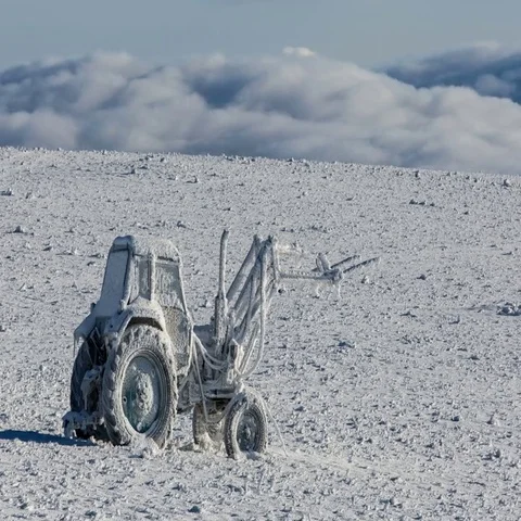 A broken tractor ,The formation and movement of clouds above the volcano Elbrus Video stock 69391050