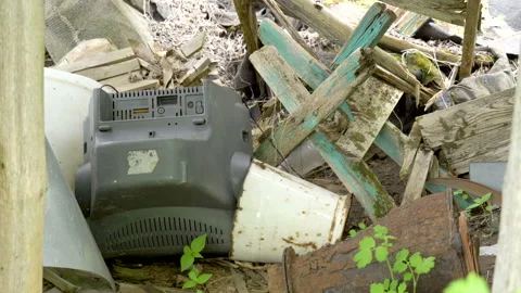 The broken TV and other garbage on the ground Stock Footage 137360190