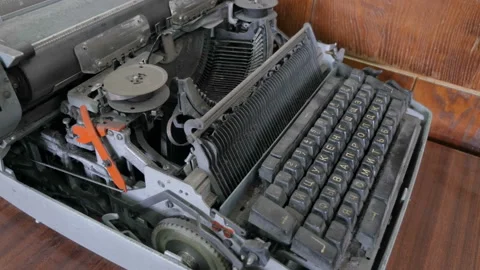 A broken typewriter is shown as well as the various parts contained therein. Stock Footage 95265097