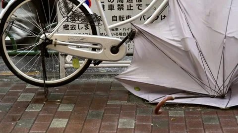 Broken umbrella during a typhoon. Stock Footage 8682655