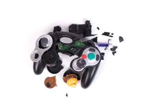 Broken video game controller on white background Stock Photos