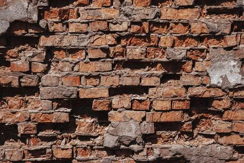 Broken Wall Background. Old brick wall texture. Stock Photos