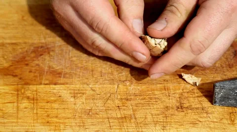 Broken walnut with hammer Stock Footage 35712953
