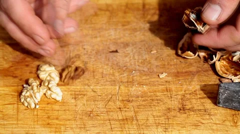 Broken walnut with hammer Stock Footage 35712982