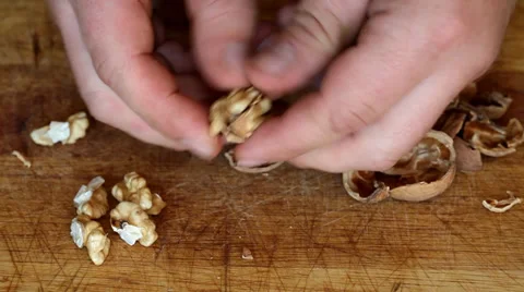 Broken walnut with hammer Stock Footage 35713186