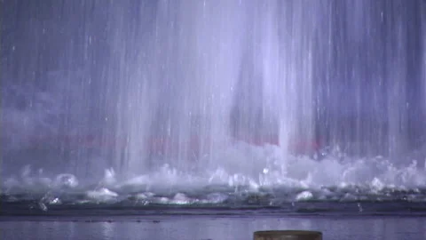 Broken water pipe fire hydrant geyser at night with falling water Stock Footage 219303668