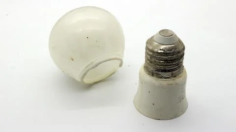 Broken white bulb isolated 写真素材