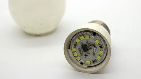 Broken white bulb isolated Stock Photos