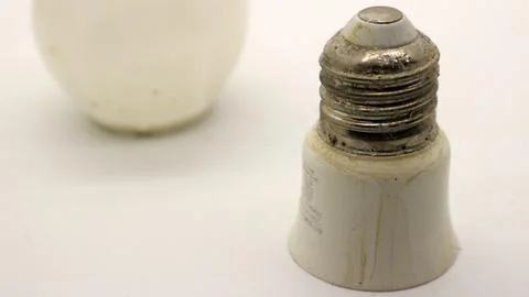Broken white bulb isolated Stock Photos