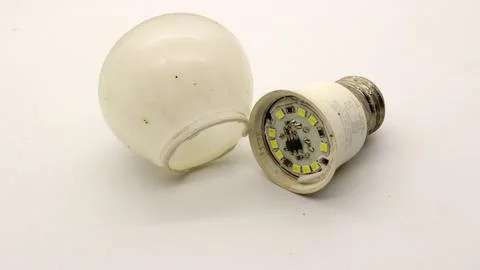 Broken white bulb isolated 写真素材