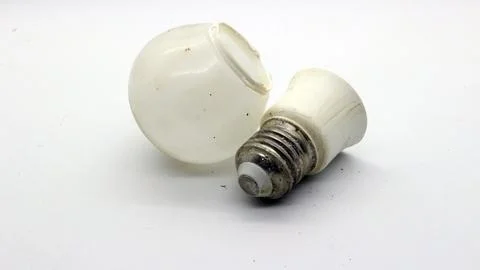 Broken white bulb isolated Stock Photos