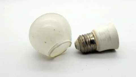 Broken white bulb isolated Stock Photos