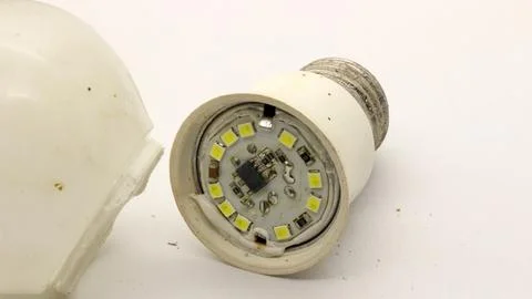 Broken white bulb isolated Stock Photos