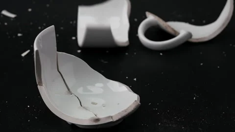 Broken white cup for tea or soup isolated on black background. Stock Footage 248503667