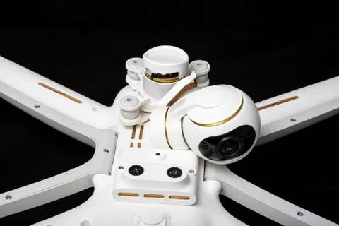Broken white drone after a fall. Isolated on a black background. Damaged stab Stock Photos