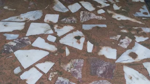 Broken White Marble Chips In Brown Concrete Floor Video Clip Stock Footage 332104742