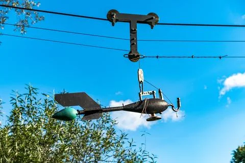 Broken wind measuring device over river Stock Photos