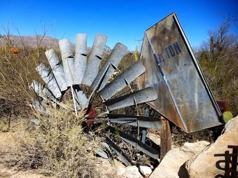 Broken windmill top section lying on ground Stock Photos