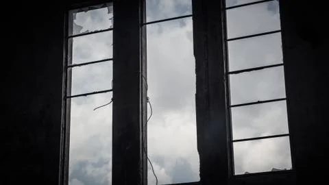 Broken window in an abandoned building Stock Photos