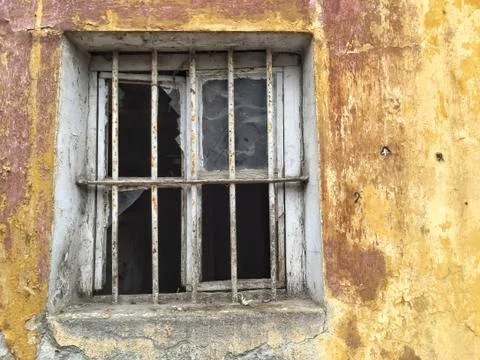 Broken window of an abandoned building Stock Photos