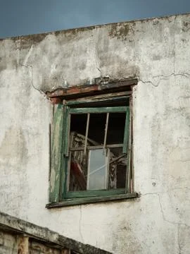 Broken window into abandoned building Stock Photos