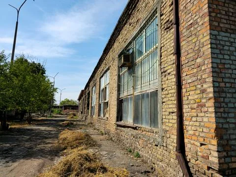 Broken window in an abandoned building. Stock Photos