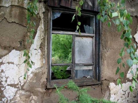 Broken window in abandoned house Stock Photos
