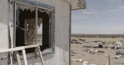 Broken Window and Yard of Junk at Dilapidated and Abandoned House Stock Footage 89942309