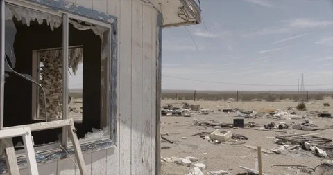 Broken Window and Yard of Junk at Dilapidated and Abandoned House  Pan L Stock Footage 89942316