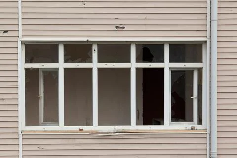 Broken window apartment building Stock Photos
