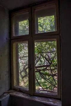Broken window in a devastated house Stock Photos