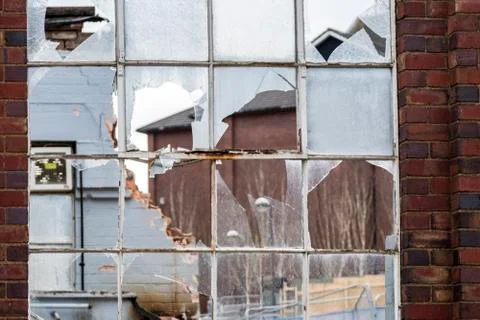 Broken window of a dilapidated building 写真素材