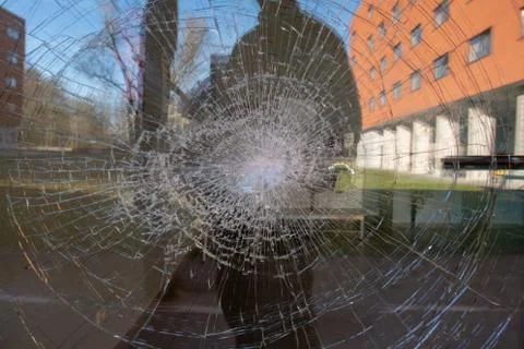 Broken window in a door Stock Photos