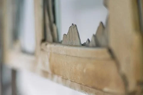 Broken window during a fire caused by military shelling. Broken window of res Foto stock