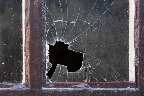 Broken window glass in close-up Stock Photos