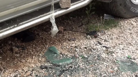Broken window glass under a blown up car 2 Video stock 47404336