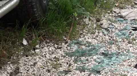 Broken window glass under a blown up car Video stock 47404574