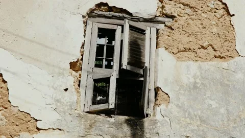 A broken window hanging offf the wall Stock Footage 163982845