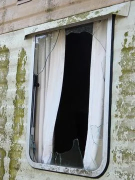 Broken window on home Stock Photos