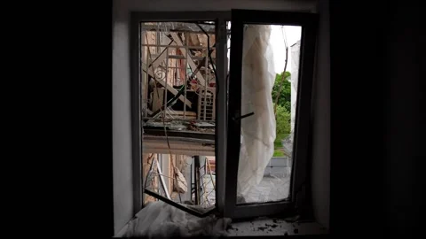 Broken window of the house during the shelling of civilian buildings. Stock Footage 196416476